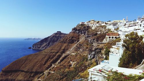 Panoramic view of sea and buildings against clear sky