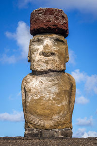 Low angle view of stone stack against sky