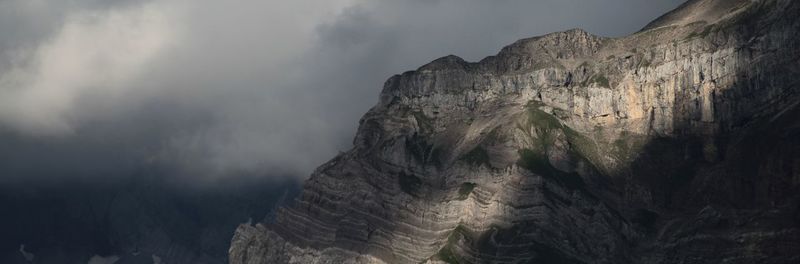 Low angle view of rock formations against sky