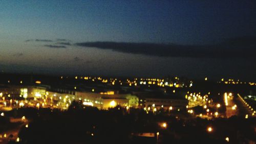 Illuminated cityscape at night