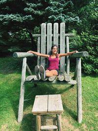 Man sitting on bench in park