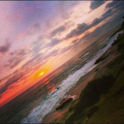 Scenic view of sea against cloudy sky