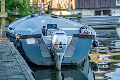 Close-up of boats moored on street