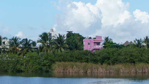 Panoramic view of lake and buildings against sky