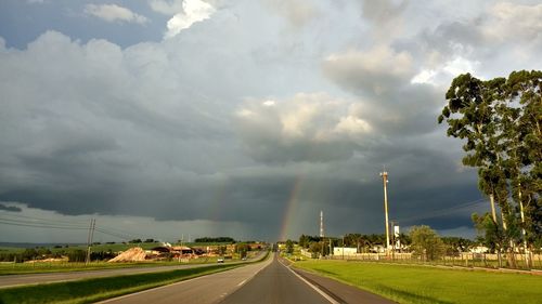 Storm clouds over road