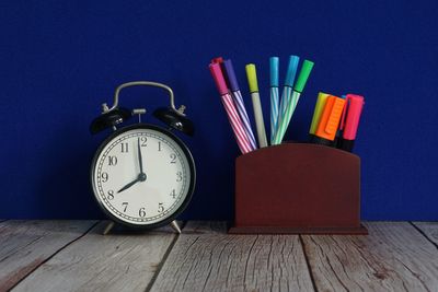 Directly above shot of clock on table