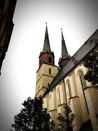 Low angle view of bell tower against sky