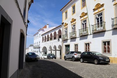 Cars parked on street in city