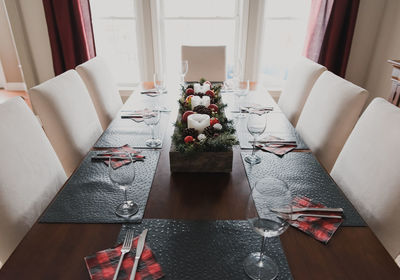 Close up of a dining table set for a christmas holiday dinner.