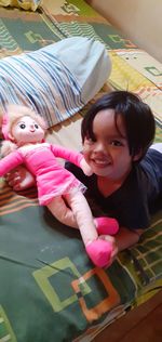 Portrait of smiling girl with toy toys