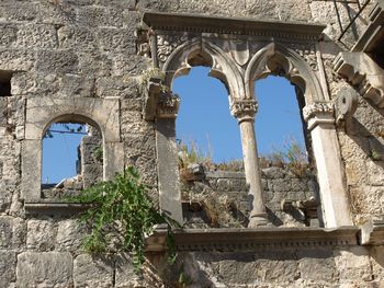 Low angle view of old building against sky