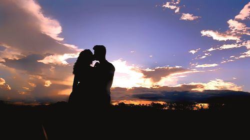 Silhouette of horse against sky during sunset