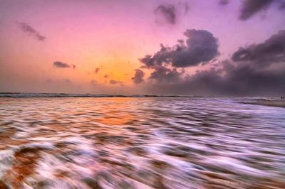 Scenic view of sea against dramatic sky