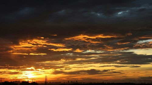 Scenic view of landscape against cloudy sky