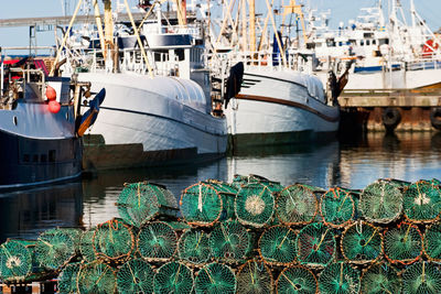 Fishing boats moored at harbor