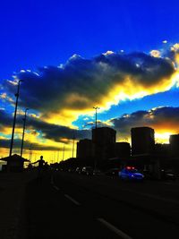 Cars on road at sunset