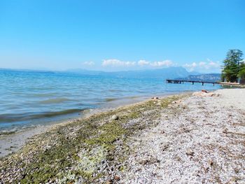Scenic view of sea against blue sky
