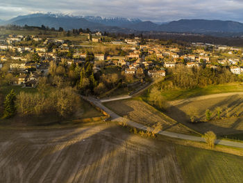 Aerial view of townscape against sky in city