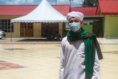 A muslim imam wearing an islamic dress and wearing a turban, during malaysia movement control order 