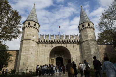 Group of people in front of historical building