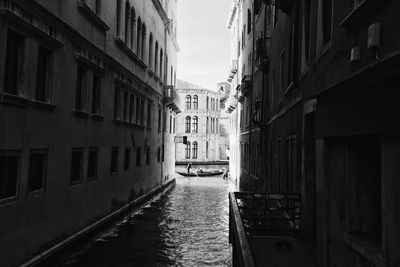 Canal amidst buildings in city