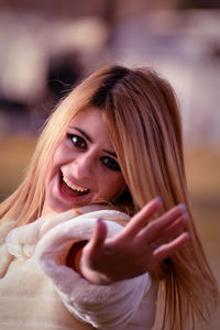Close-up portrait of a smiling young woman
