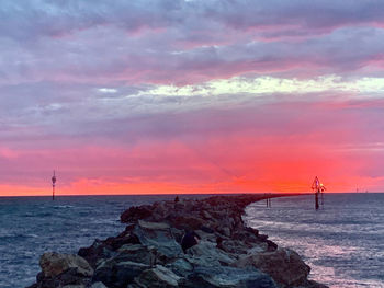 Scenic view of sea against sky during sunset