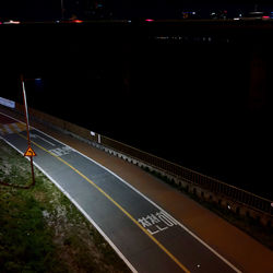 High angle view of railroad tracks at night