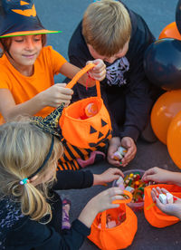 High angle view of people with toy