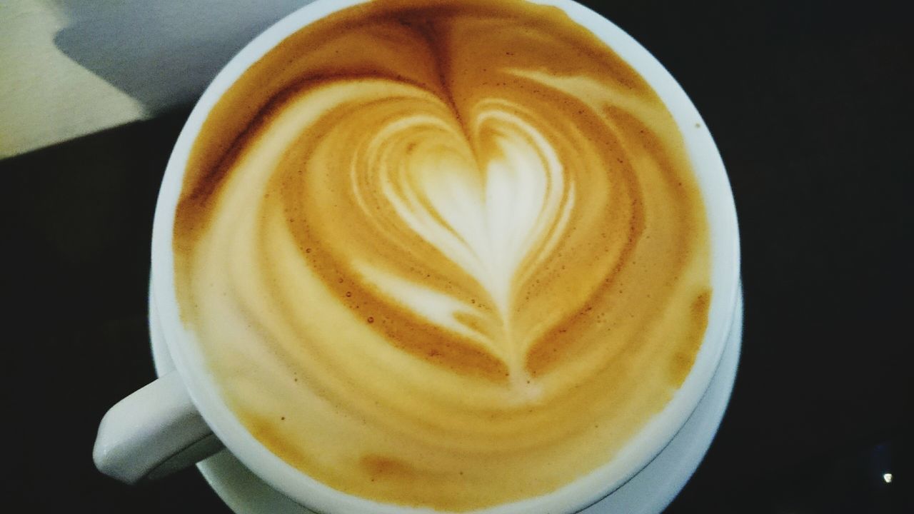 coffee cup, froth art, drink, cappuccino, frothy drink, coffee - drink, food and drink, refreshment, saucer, indoors, coffee, table, still life, freshness, close-up, art, latte, creativity, heart shape, cup