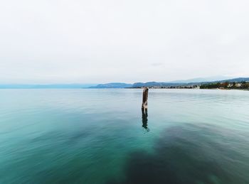 Scenic view of garda lake against sky