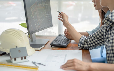 Low angle view of man working on table
