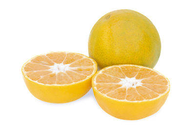 Close-up of oranges against white background