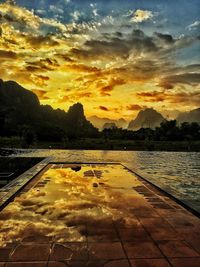 Scenic view of lake against sky during sunset