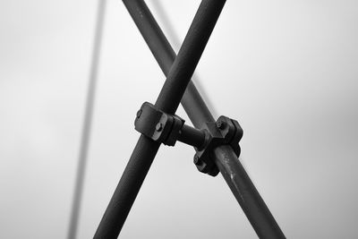 Low angle view of telephone pole against clear sky