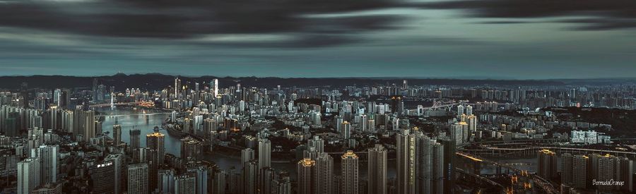 High angle view of modern buildings in city against sky