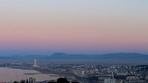 High angle view of buildings against sky during sunset