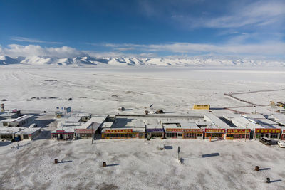 High angle view of snowcapped mountains against sky