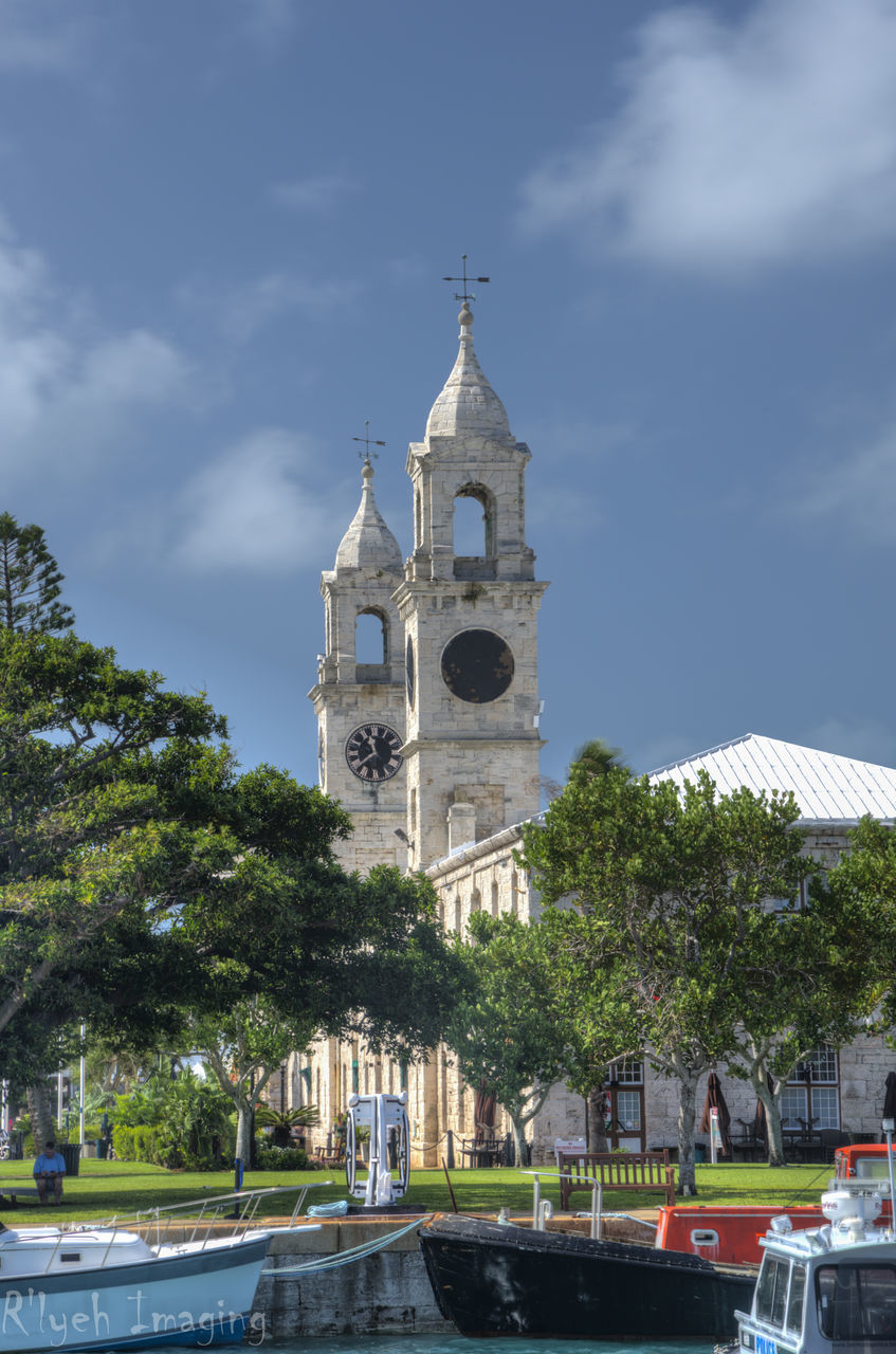 architecture, building exterior, built structure, religion, place of worship, church, tree, spirituality, sky, low angle view, travel destinations, facade, city, day, tourism, cloud - sky, outdoors, cloud, no people