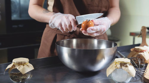 Midsection of woman preparing food on table