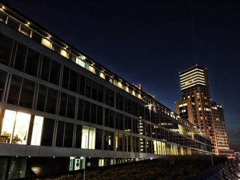 Low angle view of modern building at night