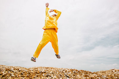 Man jumping on hill