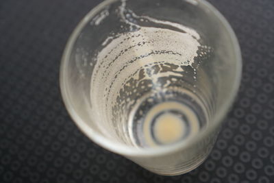 High angle view of glass of water on table