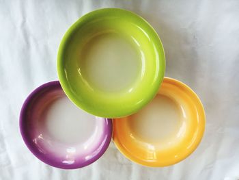 Directly above shot of multi colored bowls on table