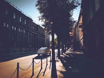 Cars on street amidst buildings in city