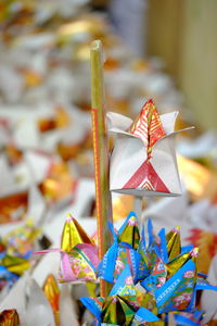 Close-up of multi colored umbrella on paper