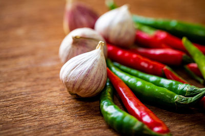 Close-up of chili peppers on table