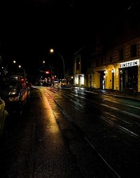 View of illuminated street at night