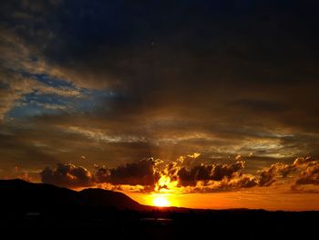 Scenic view of dramatic sky during sunset