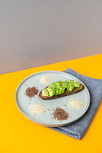 Ingredients for healthy avocado toast. sesame flax seeds. vegan keto diet. healthy eating. vegetaria